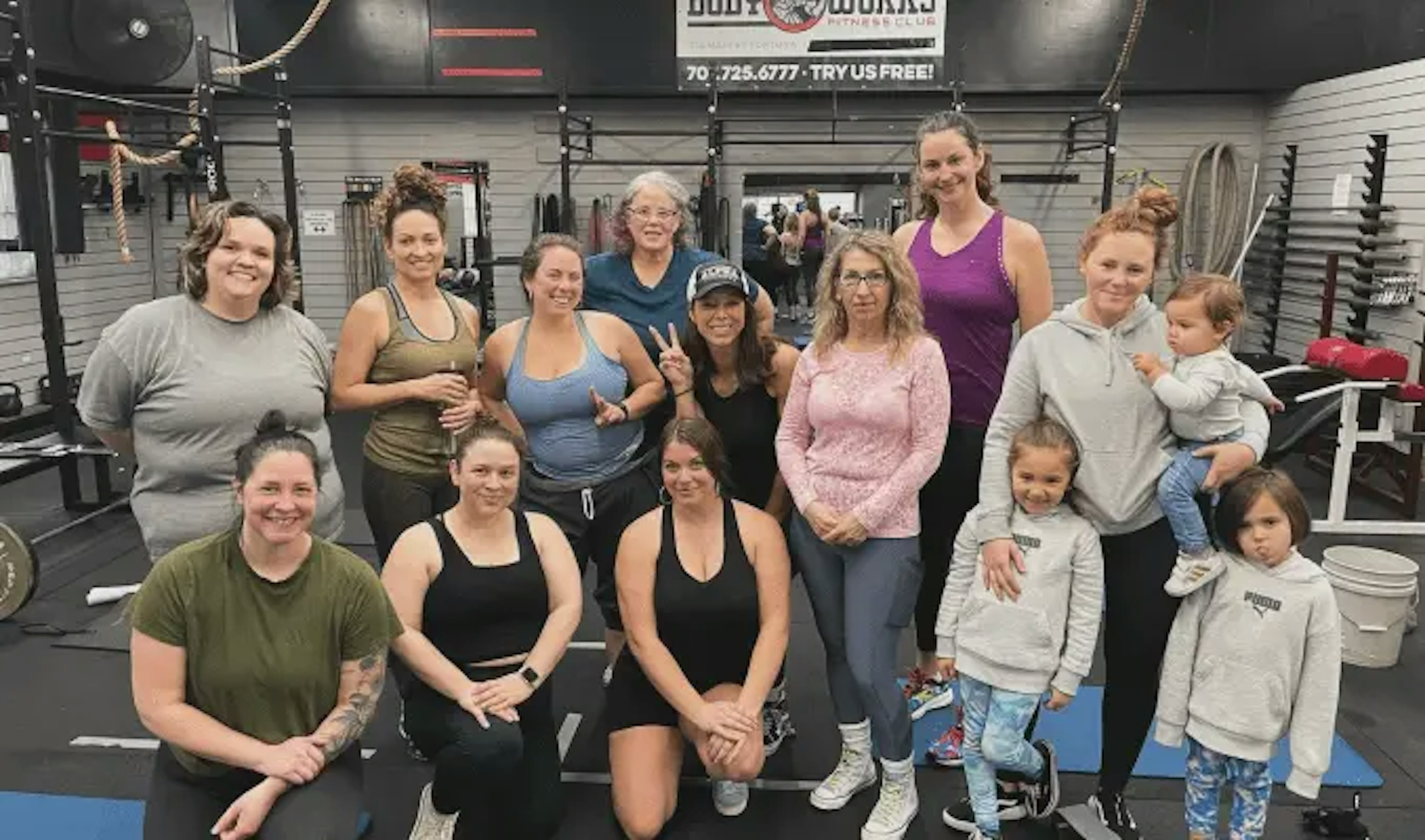 Large group in Womens Weightlifting class posing for a picture.